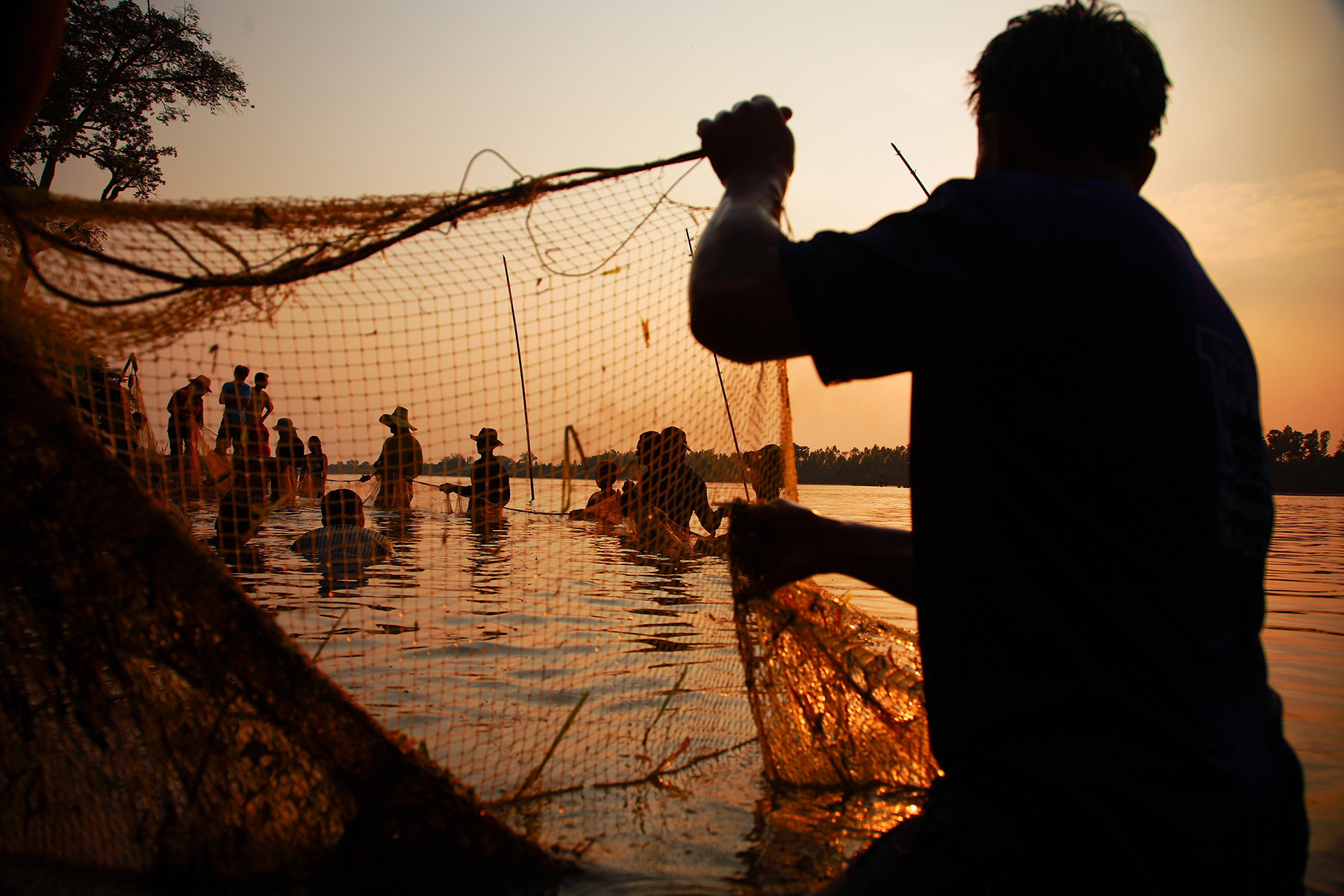 Fishermen cast their nets