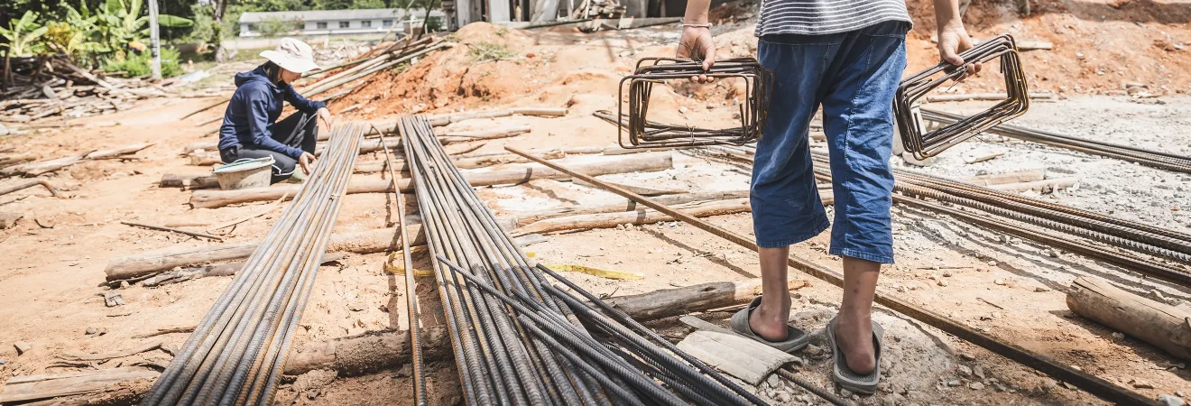 Two child workers on a construction site
