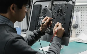 Man working on a computer circuit board