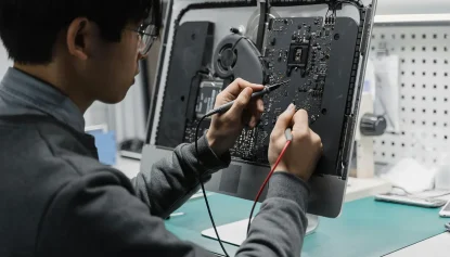 Man working on a computer circuit board