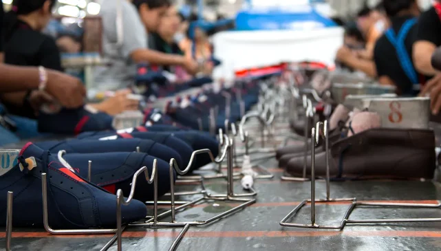 People working on the production line at a shoe factory