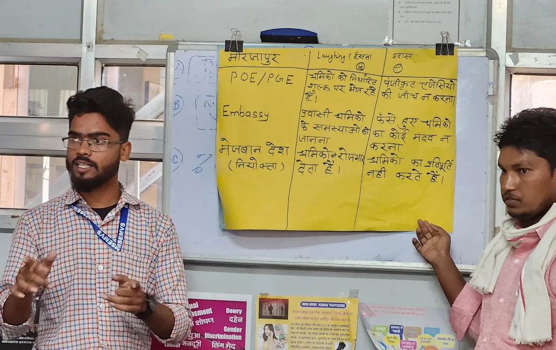 Stakeholder dialogues preparation workshop in India: Two men stood in front of a whiteboard