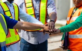 Workers collaborating on ethical recruitment